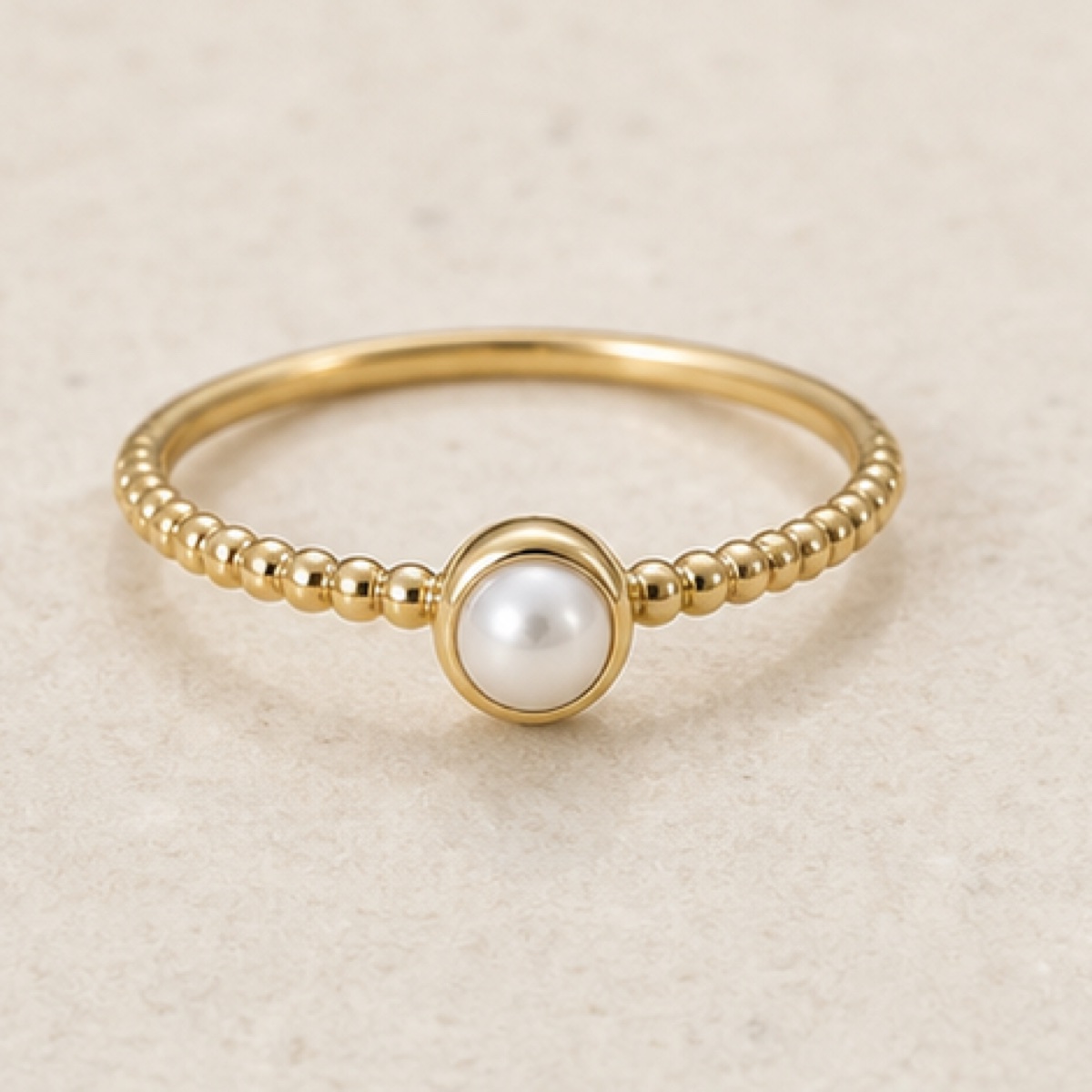 Close view of pale stones and pearl surfaces