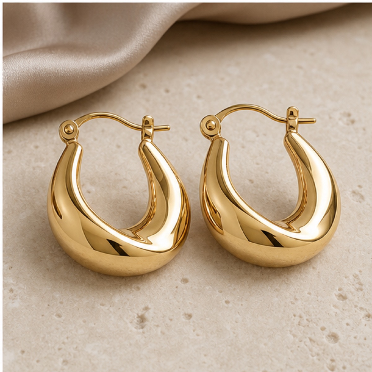Lumière Hoop Earrings styled on warm stone
