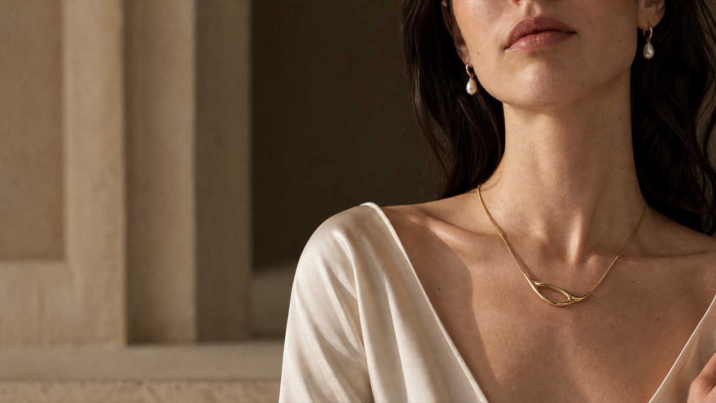 Pearl Arc Earrings worn in soft natural light