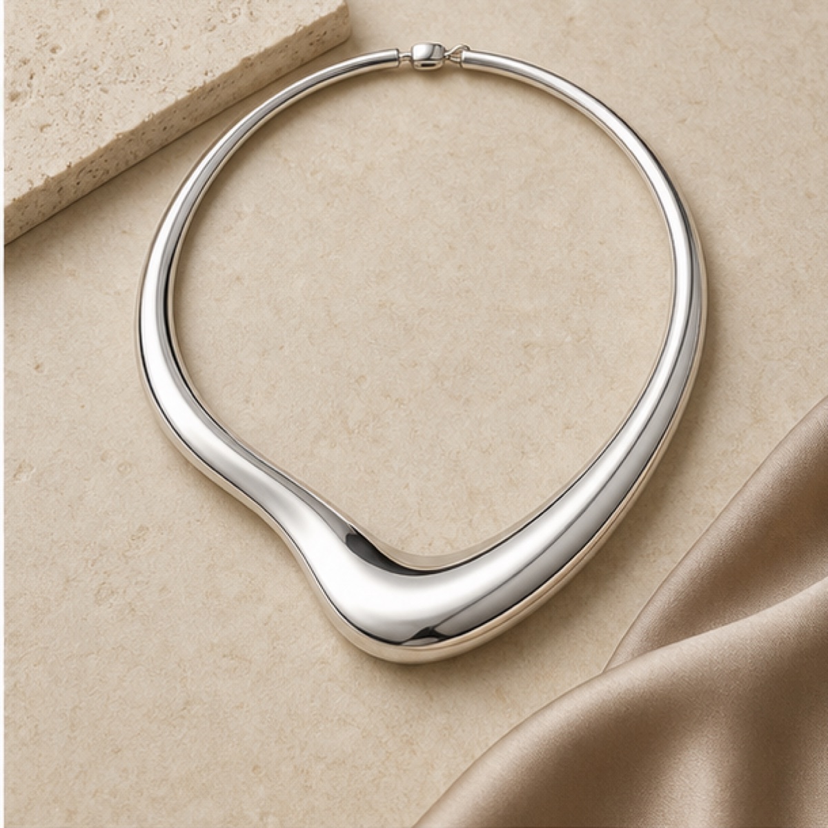 Sculpted Collar Necklace styled on warm stone